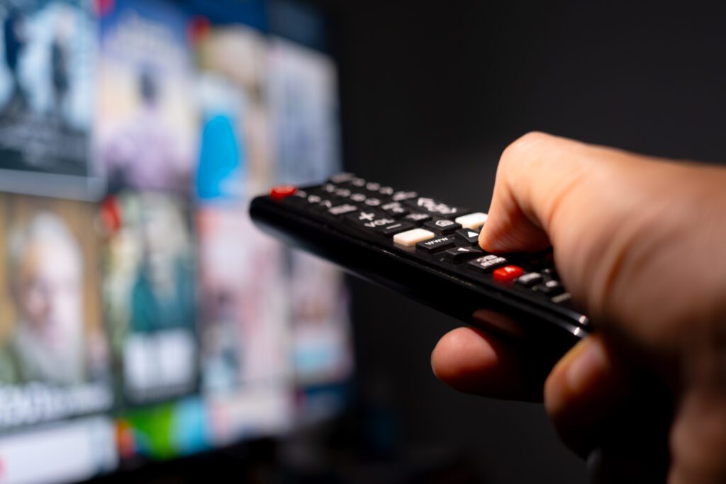 Streaming-TV Advertising His hand was holding a remote control. Multimedia TV