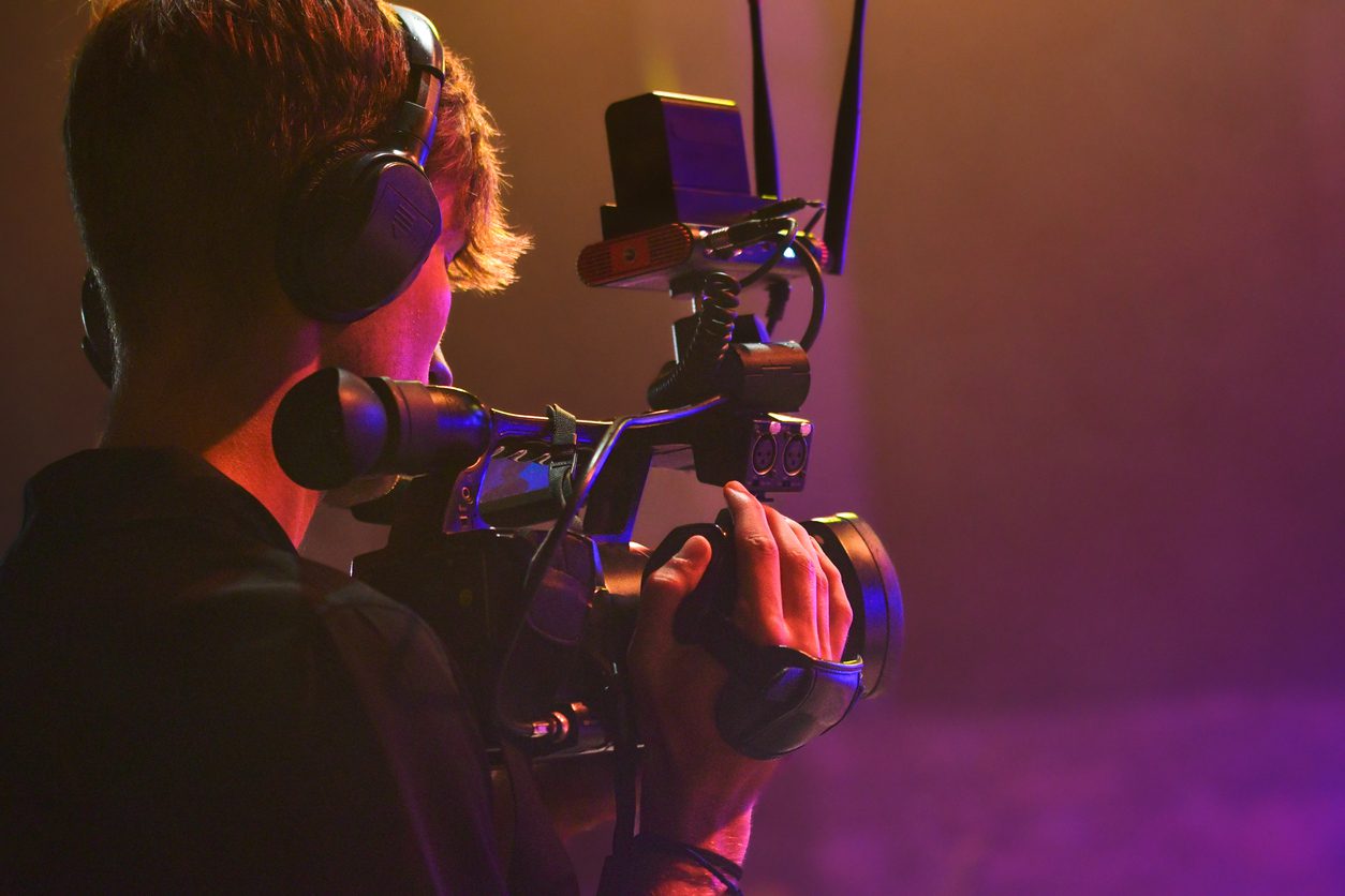 Young Videographer Filming Live Event – Professional Camera Operator on Movie or TV Stage